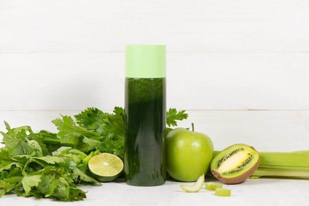 39232192 detox concept glass jar of fresh drink green smoothie spinach leaves cucumber apple lime fruit