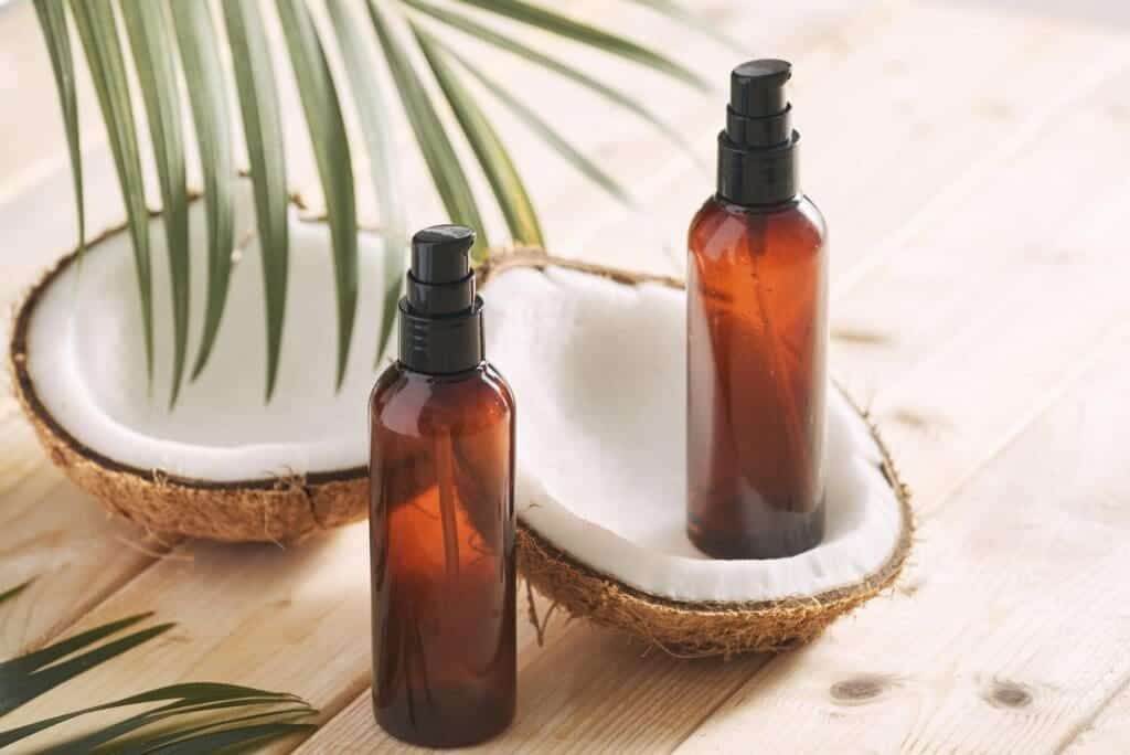39301608 coconut oil with fresh coconut for alternative therapy on wooden background