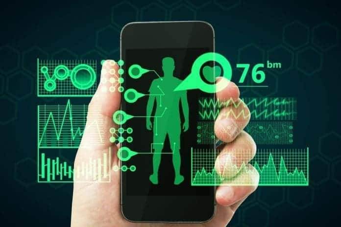Close up of businessman hand holding smartphone with creative medical interface on dark background. Online medicine and healthcare concept
