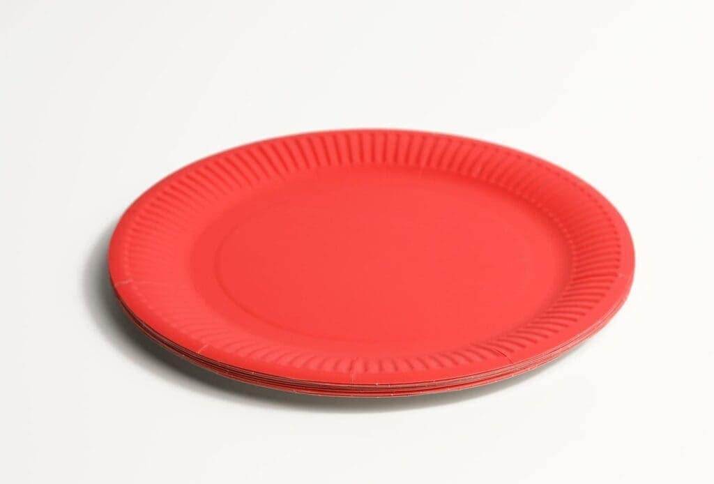 35733800 empty red paper disposable plates on a white background top view the concept of rejection of plastic
