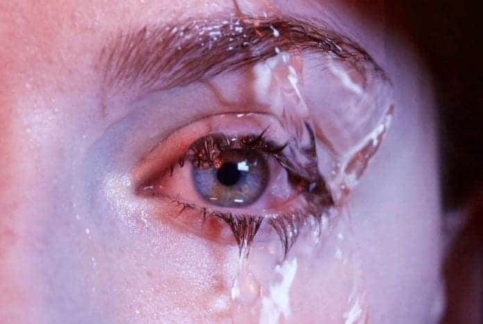An eye getting wet by the dripping water - causes for eye watering.